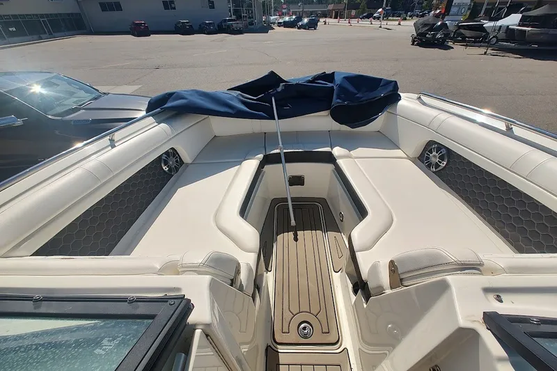 Slide: The Image of 2021 Sea Ray SDX 270 Outboard boat interior with spacious seating and modern design. - 13