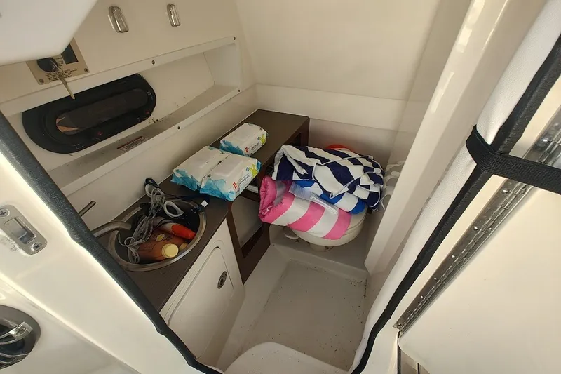 Slide: The Image of Interior of 2021 Sea Ray SDX 270 Outboard boat with storage and supplies. - 19