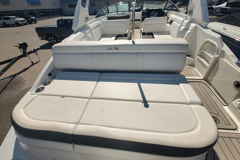 Slide: The Image of 2021 Sea Ray SDX 270 Outboard boat with spacious white seating and cup holders. - 24