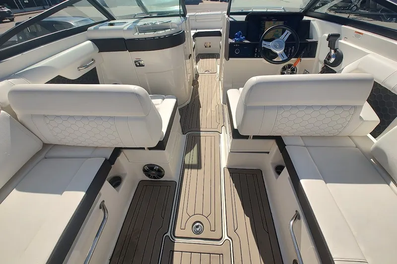 Slide: The Image of 2021 Sea Ray SDX 270 Outboard interior with luxurious seating and modern dashboard. - 20