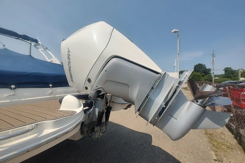Slide: The Image of 2021 Sea Ray SDX 270 Outboard with Mercury engine, docked under clear blue sky. - 7