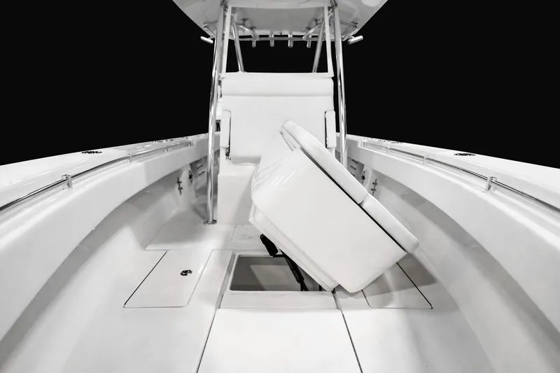Slide: The Image of Manufacturer Provided Image: 2026 Contender 30 ST boat interior with sleek white seating and storage compartment. - 9