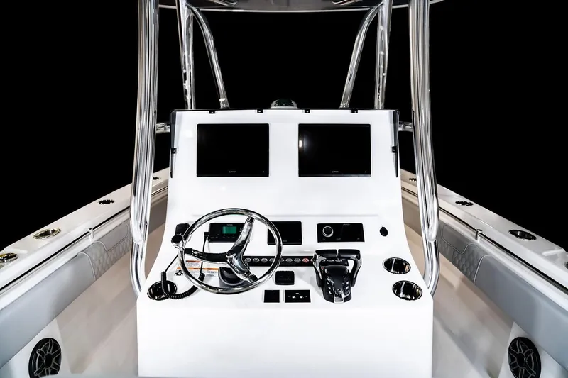 Slide: The Image of Manufacturer Provided Image: 2026 Contender 30 ST boat console with dual screens and steering wheel. - 10
