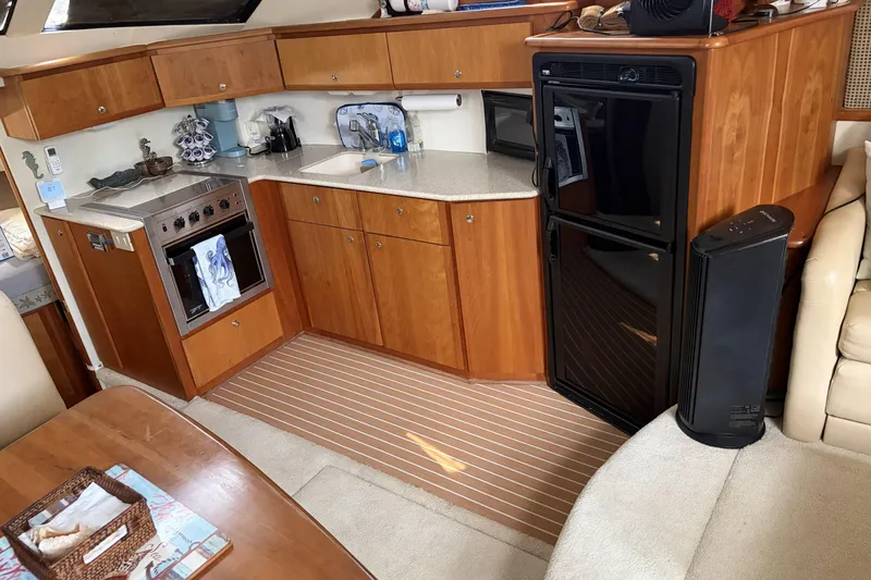 Slide: The Image of Interior of 2002 Silverton 392 Motor Yacht with kitchen and appliances. - 39