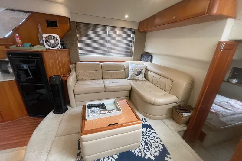 Slide: The Image of Luxurious interior of a 2002 Silverton 392 Motor Yacht with beige leather seating. - 29