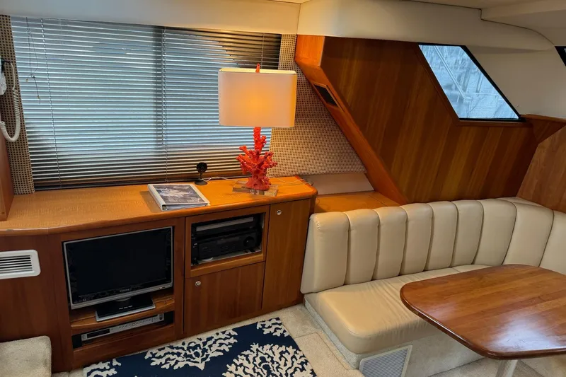 Slide: The Image of Luxurious interior of 2002 Silverton 392 Motor Yacht with elegant seating and modern amenities. - 44