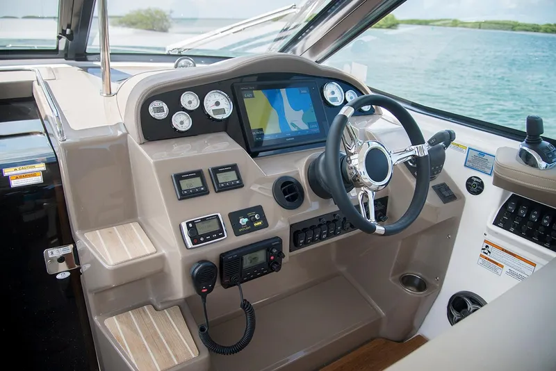 Slide: The Image of Manufacturer Provided Image: Cockpit of 2019 Regal 35 Sport Coupe with navigation system and controls. - 2