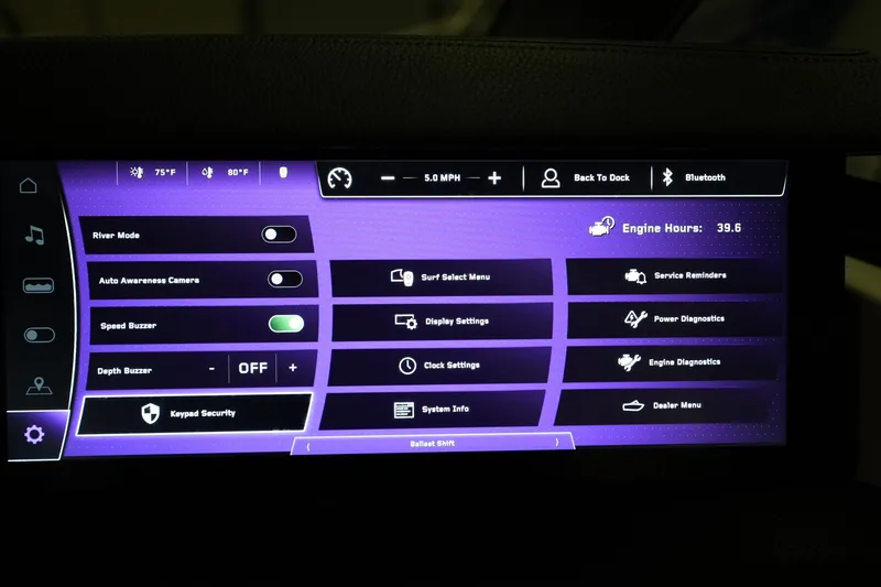 Slide: The Image of 2025 Nautique Super Air Nautique G23 dashboard display with various control options and settings. - 18