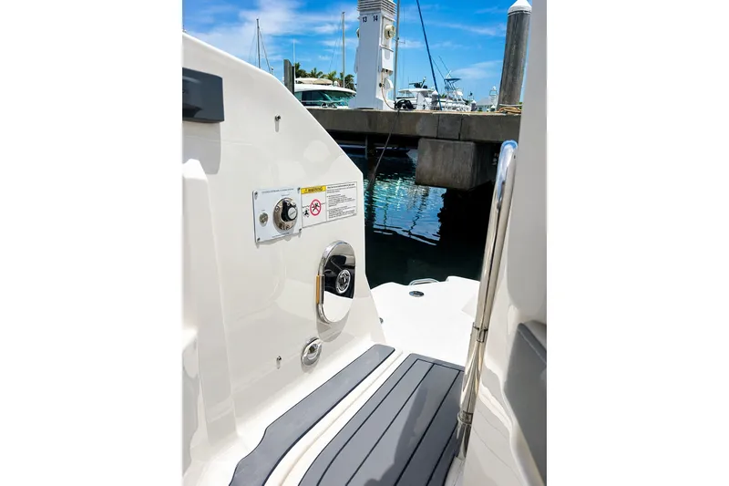 Slide: The Image of 2022 Sea Ray Sundancer 320 Coupe Outboard at marina, showing deck and dockside view. - 19