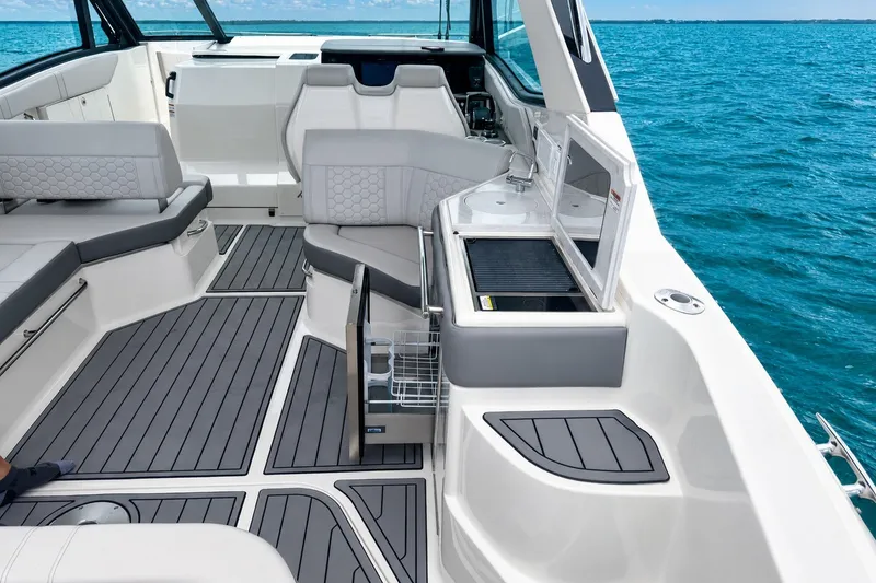 Slide: The Image of 2022 Sea Ray Sundancer 320 Coupe Outboard interior with sleek seating and ocean view. - 17