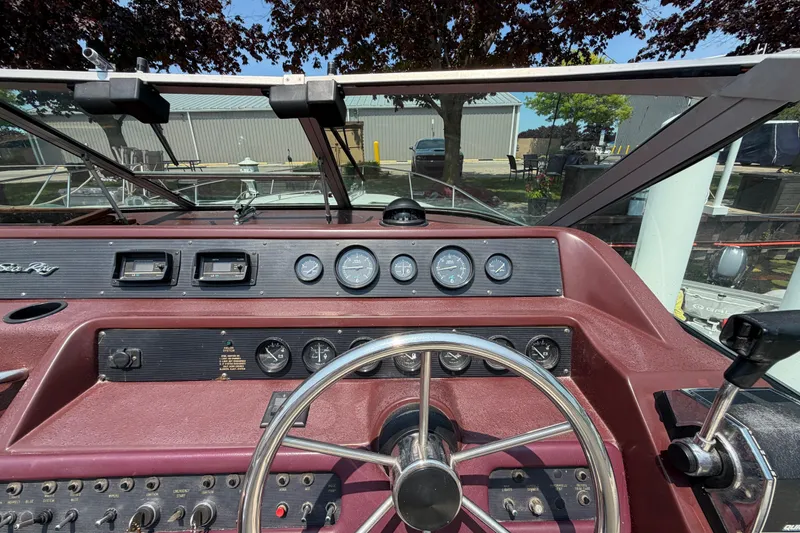Slide: The Image of 1989 Sea Ray Sundancer 280 dashboard with steering wheel and instrument panel. - 18