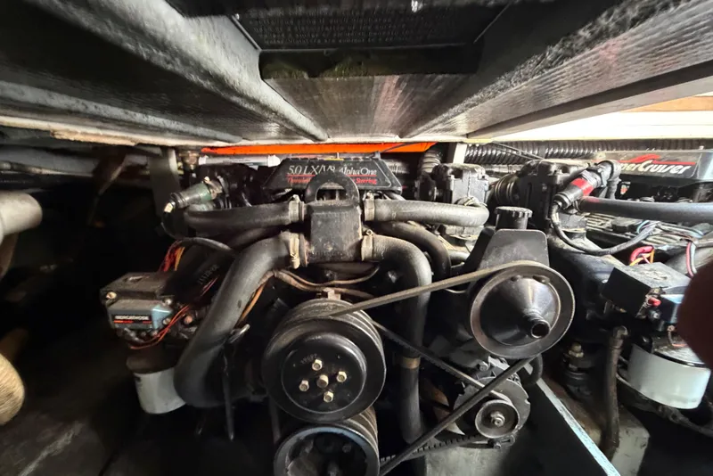 Slide: The Image of Engine compartment of a 1989 Sea Ray Sundancer 280 boat, showcasing mechanical components. - 39