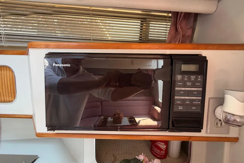 Slide: The Image of Panasonic microwave inside 1989 Sea Ray Sundancer 280 yacht kitchen area. - 25