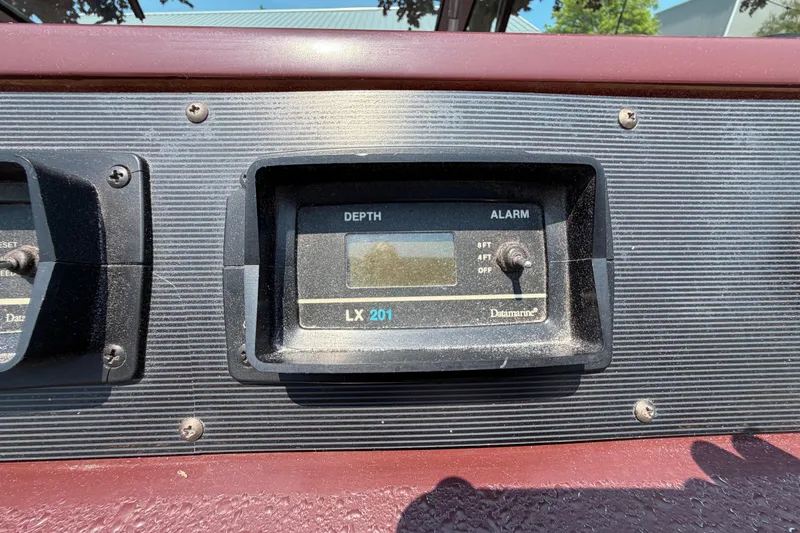 Slide: The Image of Depth gauge on 1989 Sea Ray Sundancer 280 dashboard, featuring Datamarine LX 201. - 19