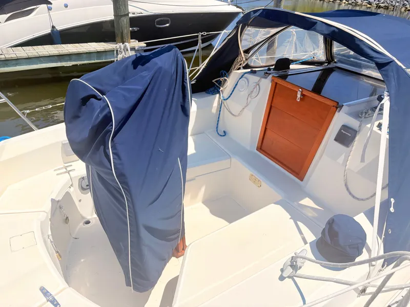 Slide: The Image of The cockpit of a 1987 Sabre 30 MK III with blue covers and wooden doors. - 3