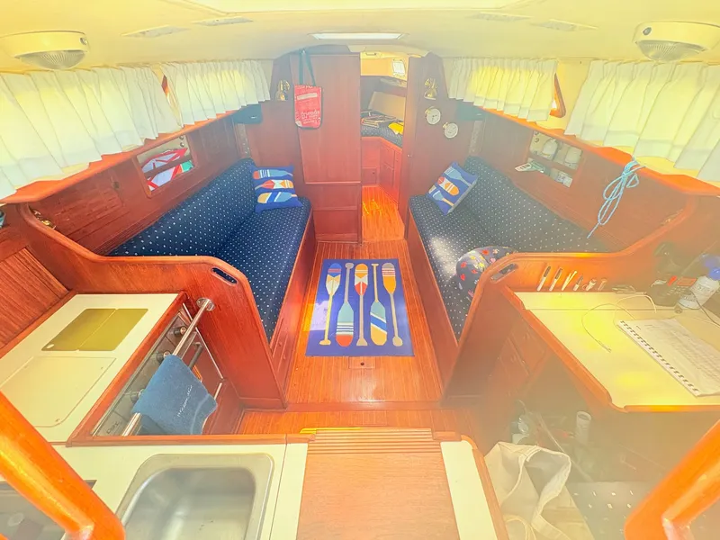 Slide: The Image of Interior of a 1987 Sabre 30 MK III with wood finish and blue upholstery. - 11
