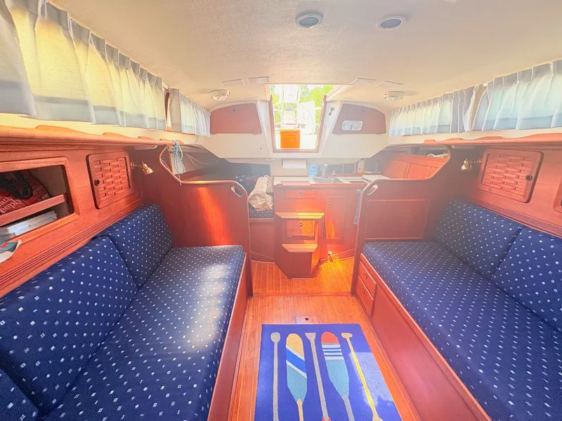 Slide: The Image of Interior of a 1987 Sabre 30 MK III with wood finish and blue upholstery. - 25