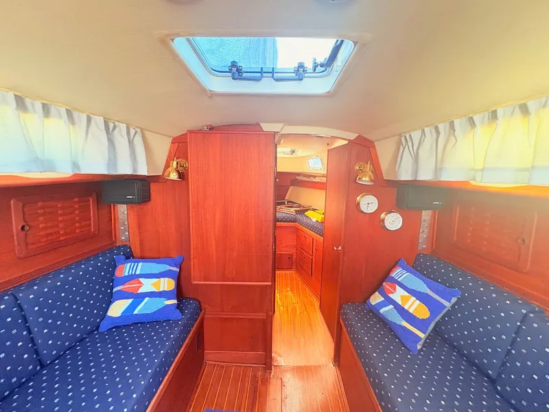 Slide: The Image of Interior of a 1987 Sabre 30 MK III with wood finish and blue cushions. - 16