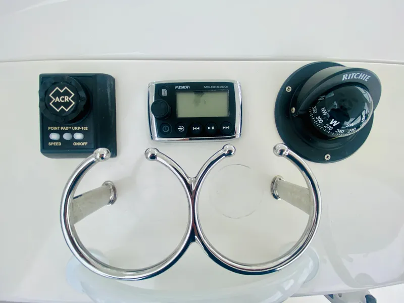 Slide: The Image of Control panel of a 2008 Intrepid 390 Sport Yacht with ACR, Ritchie compass, and Fusion stereo. - 45