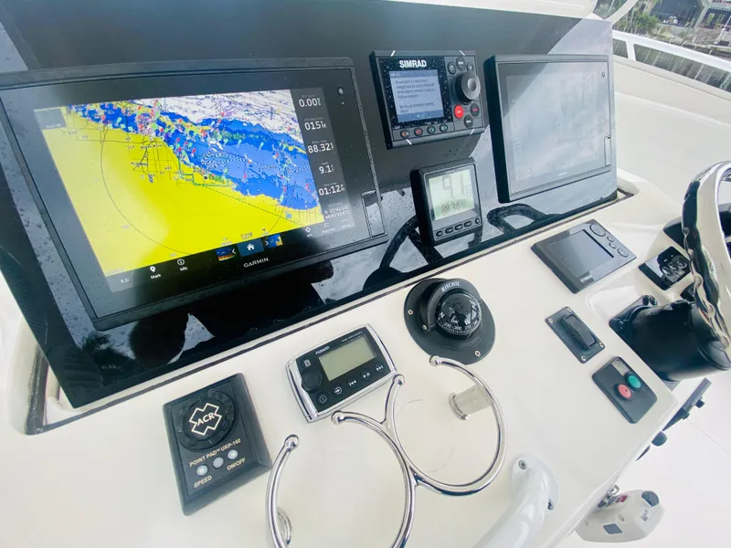 Slide: The Image of Intrepid 390 Sport Yacht 2008 helm with navigation and control systems. - 40