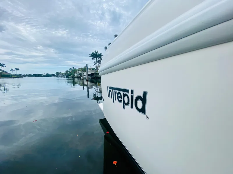 Slide: The Image of 2008 Intrepid 390 Sport Yacht on calm waters with a cloudy sky. - 47