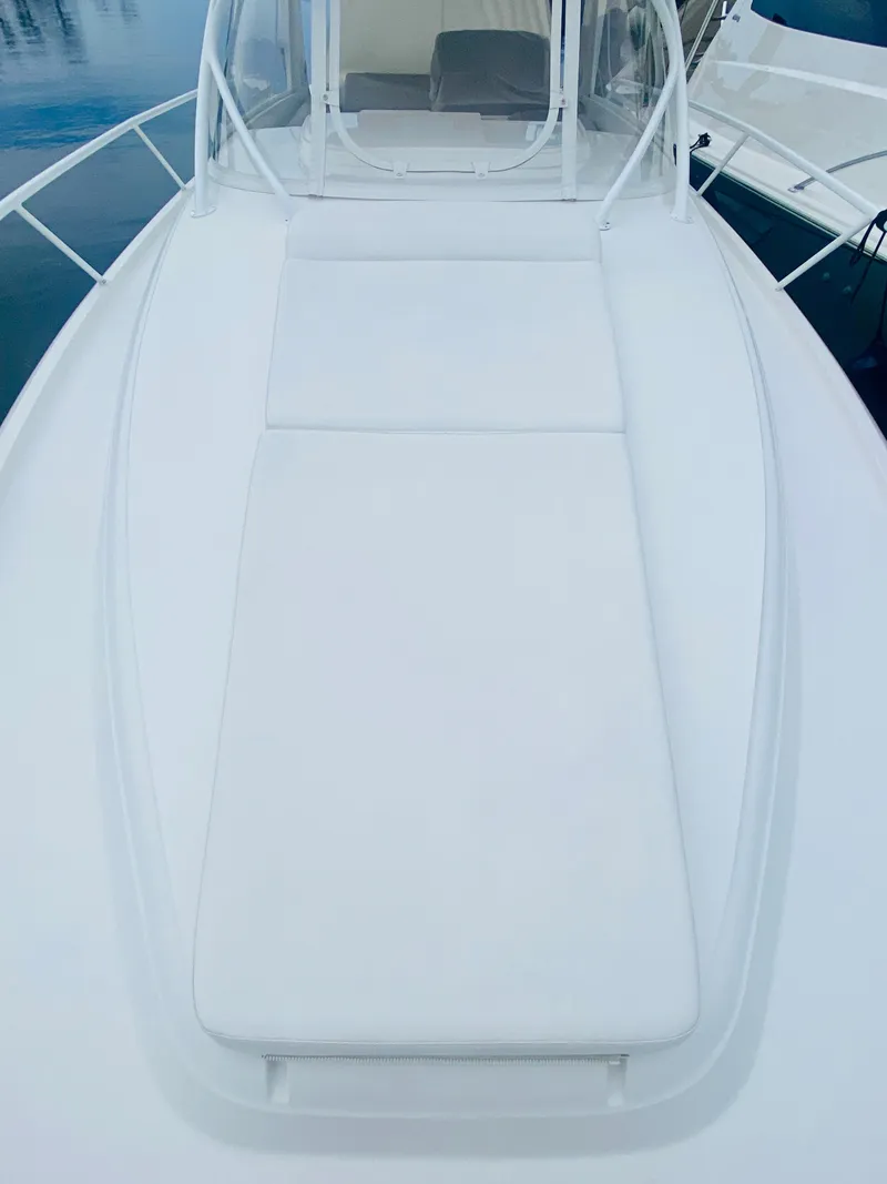 Slide: The Image of 2008 Intrepid 390 Sport Yacht bow deck with sunpad. - 17