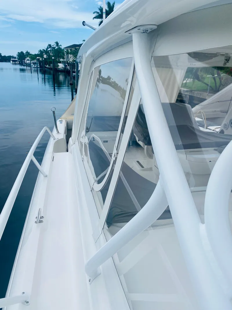 Slide: The Image of 2008 Intrepid 390 Sport Yacht docked by the water. - 18
