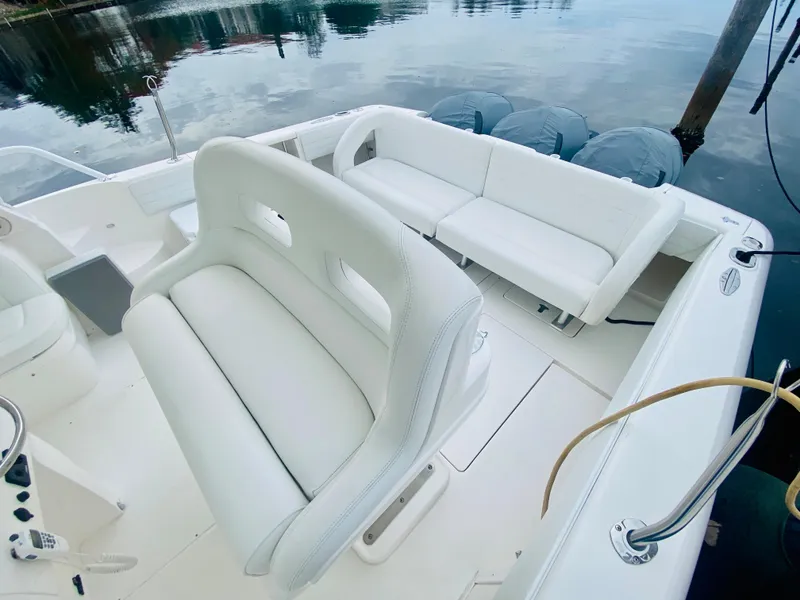 Slide: The Image of 2008 Intrepid 390 Sport Yacht with white leather seating and triple outboard engines. - 26