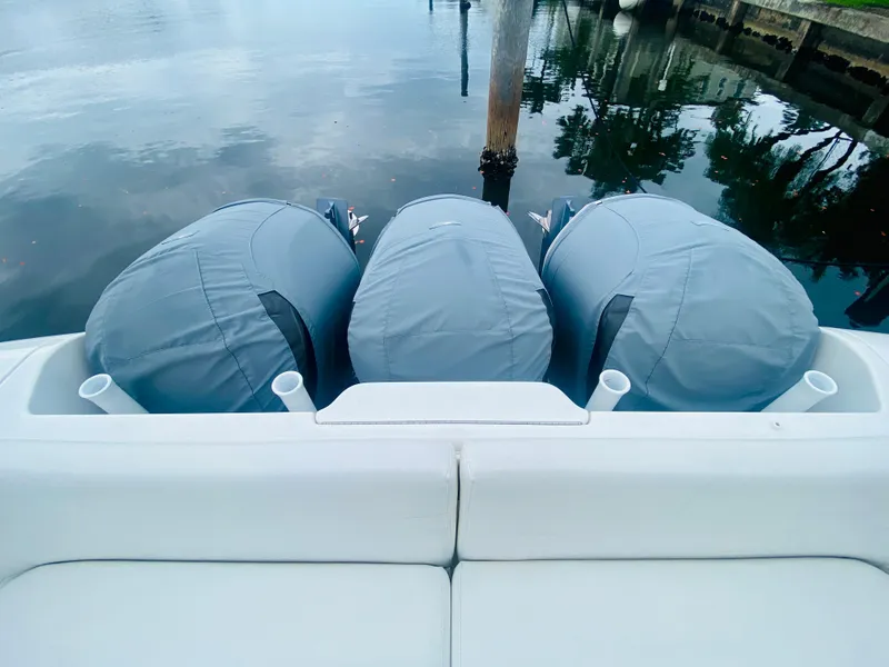 Slide: The Image of 2008 Intrepid 390 Sport Yacht with triple outboard engines at dock. - 8