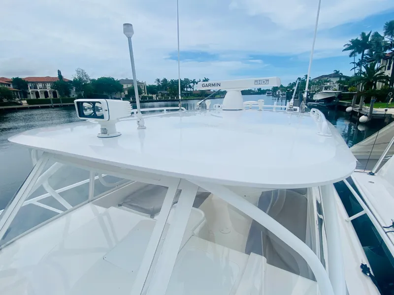 Slide: The Image of 2008 Intrepid 390 Sport Yacht docked in a scenic marina. - 13