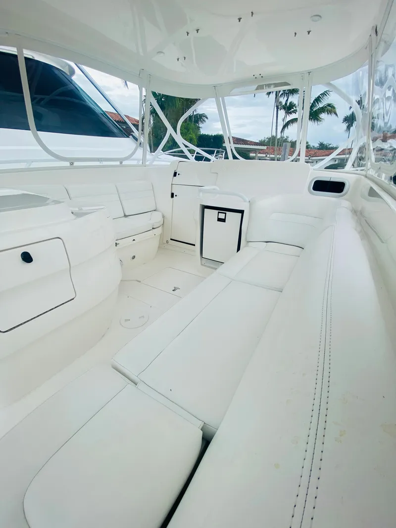 Slide: The Image of 2008 Intrepid 390 Sport Yacht interior with white seating and modern design. - 29