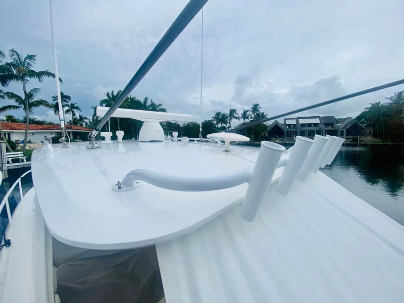 Slide: The Image of 2008 Intrepid 390 Sport Yacht on a serene waterfront. - 10