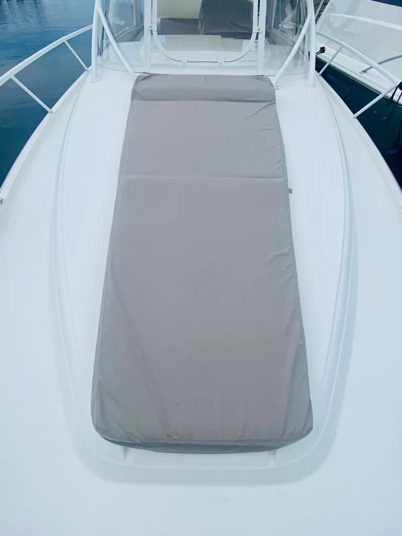 Slide: The Image of 2008 Intrepid 390 Sport Yacht with sun pad on deck. - 16
