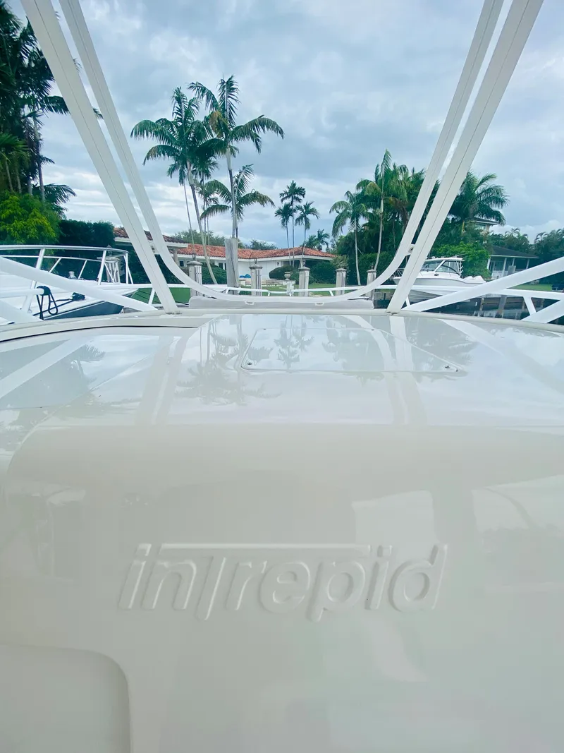 Slide: The Image of 2008 Intrepid 390 Sport Yacht with palm trees in the background. - 48