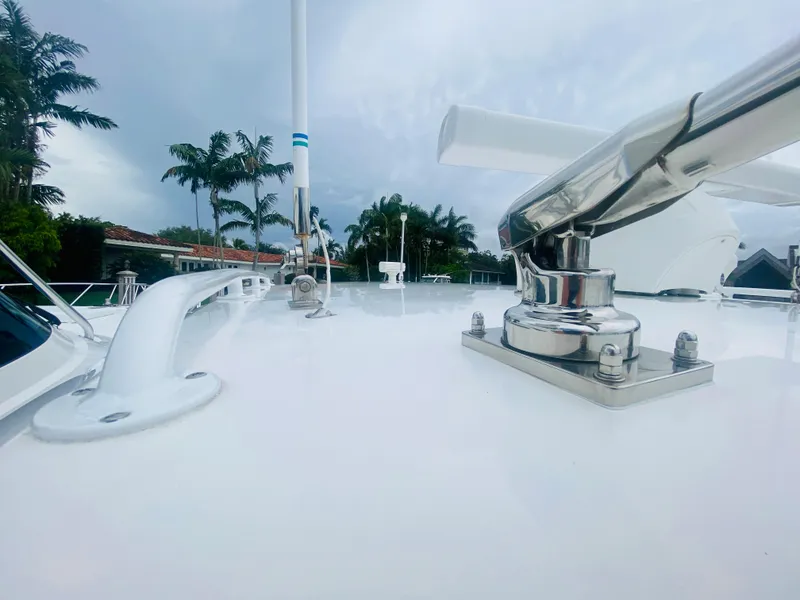 Slide: The Image of 2008 Intrepid 390 Sport Yacht deck with stainless steel fittings and tropical backdrop. - 11