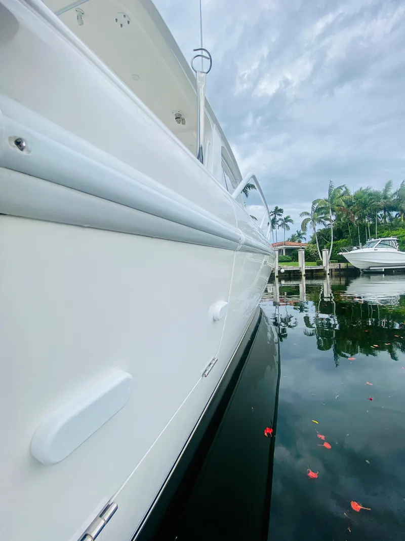Slide: The Image of 2008 Intrepid 390 Sport Yacht docked on a calm, reflective water surface. - 46