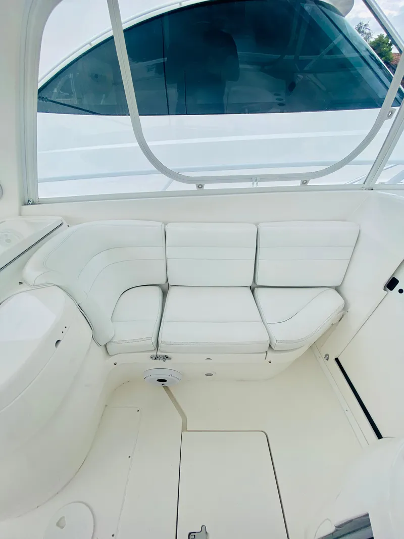 Slide: The Image of 2008 Intrepid 390 Sport Yacht interior seating area, white leather upholstery. - 31
