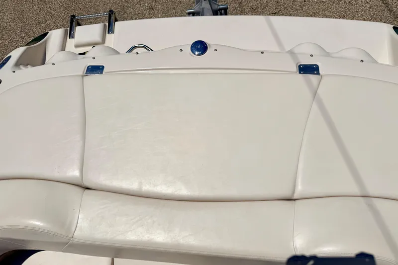 Slide: The Image of 2002 Larson LXi 210 boat with white leather seating and stainless steel accents. - 21