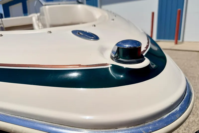 Slide: The Image of Close-up of a 2002 Larson LXi 210 boat's bow with navigation light. - 61