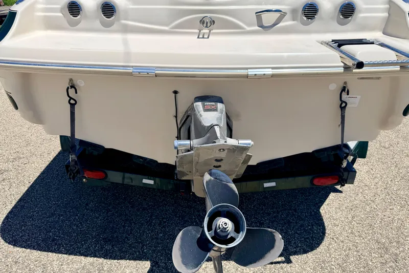 Slide: The Image of Rear view of a 2002 Larson LXi 210 boat with outboard motor. - 14