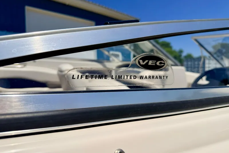 Slide: The Image of Close-up of 2002 Larson LXi 210 boat windshield with VEC lifetime limited warranty sticker. - 18