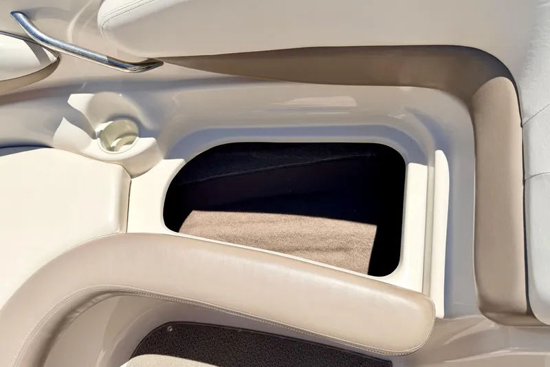 Slide: The Image of Interior seating and storage compartment of a 2002 Larson LXi 210 boat. - 55