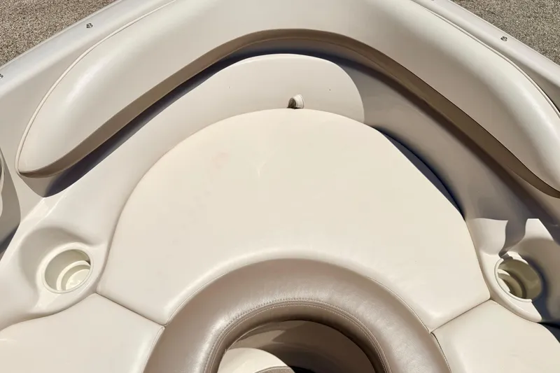 Slide: The Image of Bow seating area of a 2002 Larson LXi 210 boat with cup holders. - 52