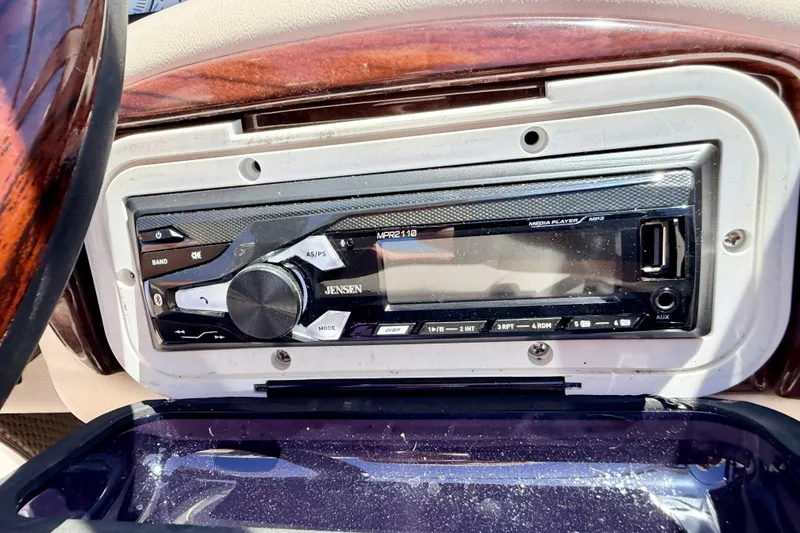 Slide: The Image of Jensen stereo system in a 2002 Larson LXi 210 boat dashboard. - 37