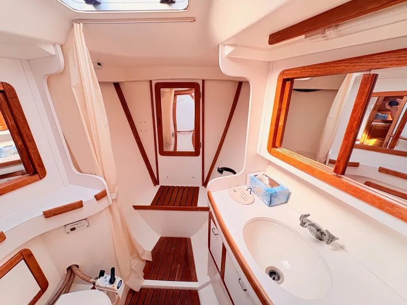 Slide: The Image of Interior of a 1994 Catalina 42 with wood trim and a sink. - 26