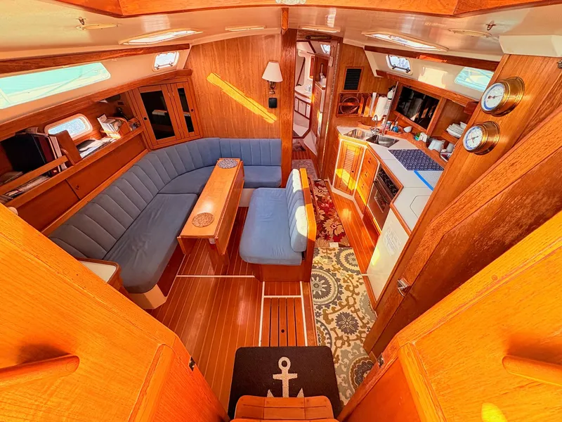 Slide: The Image of Interior of a 1994 Catalina 42 featuring a cozy salon and well-equipped galley. - 17