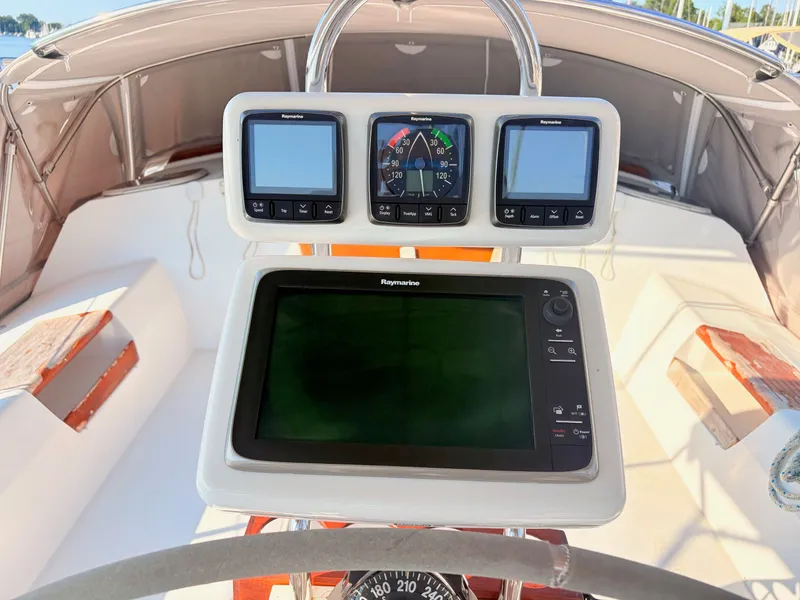 Slide: The Image of The image shows the cockpit of a 1994 Catalina 42 with modern navigation instruments. - 7