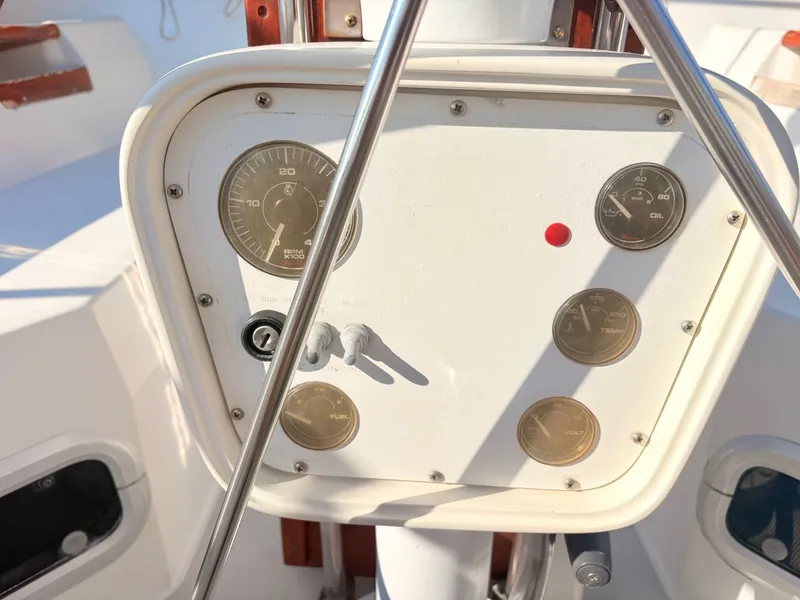 Slide: The Image of The image shows the helm of a 1994 Catalina 42 with various gauges and controls. - 9