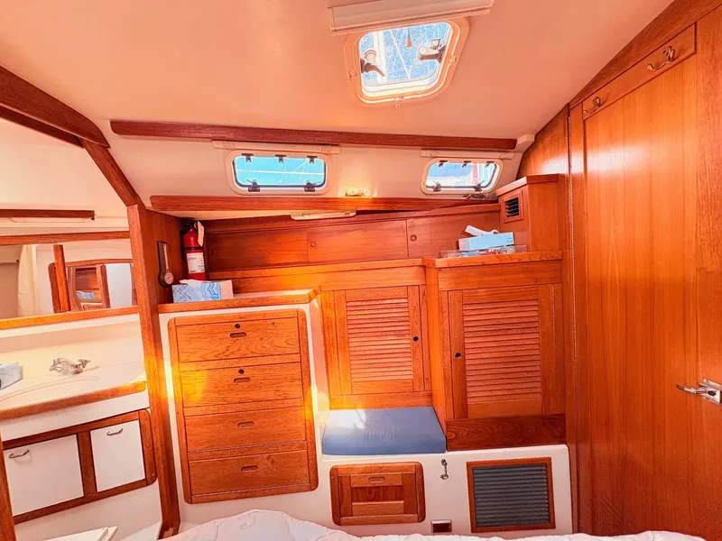 Slide: The Image of Interior of a 1994 Catalina 42 with wooden cabinets and skylights. - 23