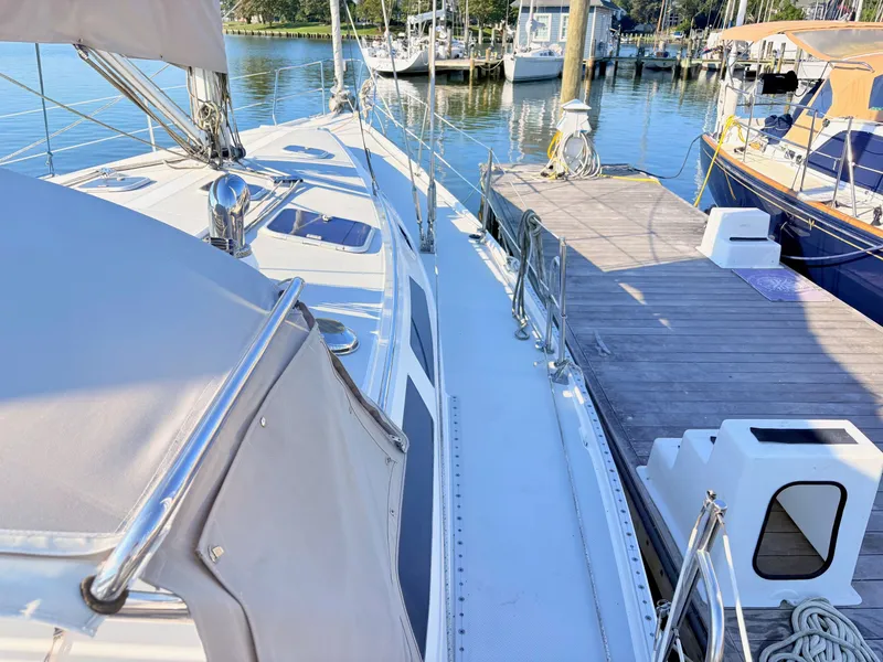 Slide: The Image of The deck of a 1994 Catalina 42 at the dock, featuring clean lines and well-maintained condition. - 10
